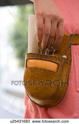 Hairdresser with scissors in pochette View Large Photo Image Stock Image - Hairdresser with scissors in pochette. Fotosearch