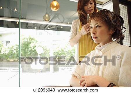 Young woman having hair dyed View Large Photo Image Stock Image - Young woman having hair dyed. Fotosearch