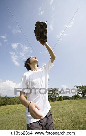One teenage boy playing catch View Large Photo Image Picture - One teenage boy playing catch. Fotosearch