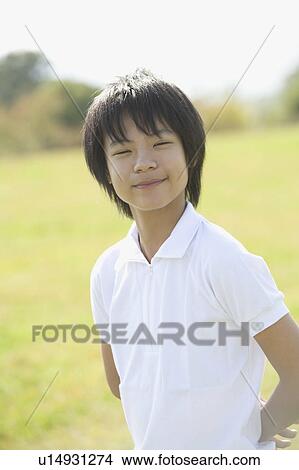 Picture - Portrait of schoolboy wearing gym clothes. Fotosearch