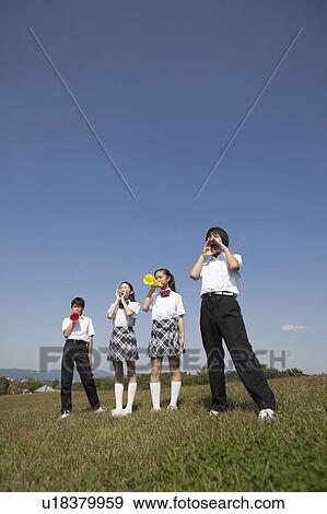School children cheering with megaphones View Large Photo Image Stock Photo - School children cheering with megaphones. Fotosearch
