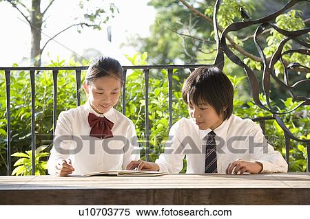 Stock Photography - School children studying. Fotosearch
