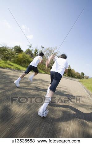 Two schoolboys running, blurred motion View Large Photo Image Stock Photo - Two schoolboys running, blurred motion. Fotosearch