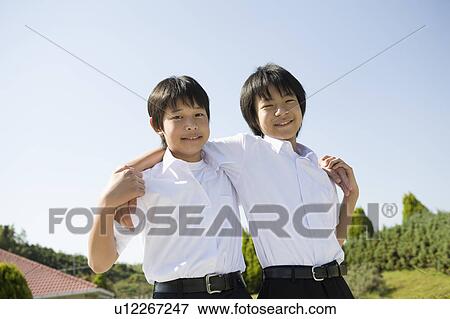 Two schoolboys standing View Large Photo Image Stock Photo - Two schoolboys standing. Fotosearch