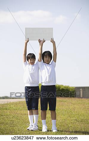 Two schoolboys wearing gym clothes View Large Photo Image Stock Photo - Two schoolboys wearing gym clothes. Fotosearch