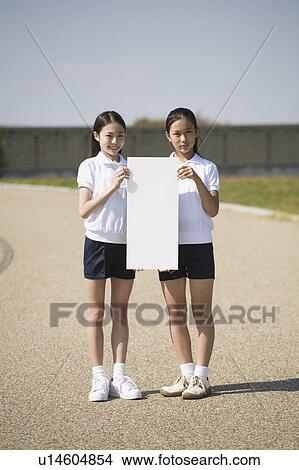 Two schoolgirls wearing gym clothes View Large Photo Image Picture - Two schoolgirls wearing gym clothes. Fotosearch