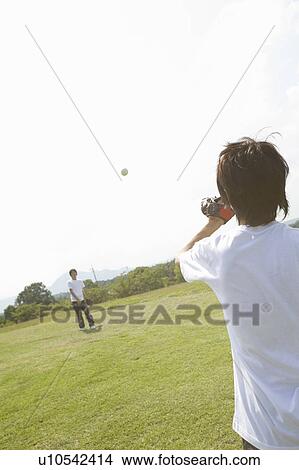 Two teenage boys playing catch View Large Photo Image Picture - Two teenage boys playing catch. Fotosearch