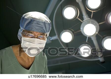 Doctor in surgery View Large Photo Image Stock Photography - Doctor in surgery. Fotosearch