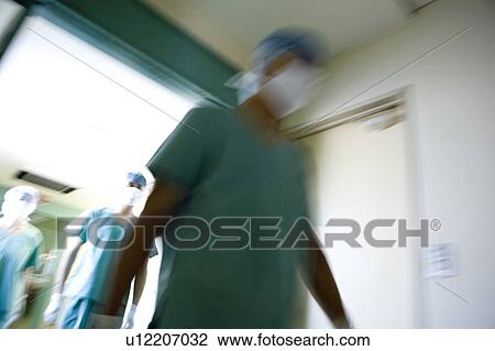 Doctors and nurse walking out of surgery View Large Photo Image Stock Image - Doctors and nurse walking out of surgery. Fotosearch