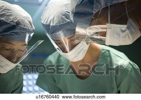 Doctors in surgery View Large Photo Image Stock Image - Doctors in surgery. Fotosearch