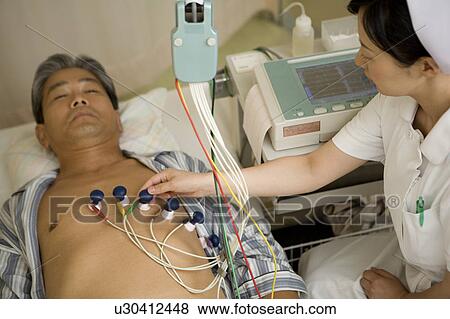 Mature man with electrode pads View Large Photo Image Stock Photo - Mature man with electrode pads. Fotosearch