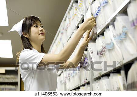 Nurse looking for medical records View Large Photo Image Stock Image - Nurse looking for medical records. Fotosearch