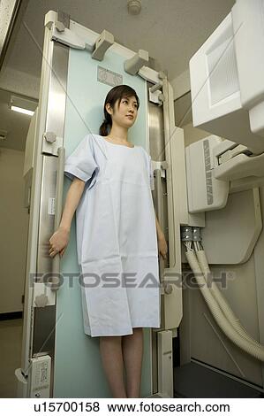 Young woman leaning against x-ray table View Large Photo Image Stock Photo - Young woman leaning against x-ray table. Fotosearch