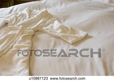 Bathrobe on bed View Large Photo Image Stock Image - Bathrobe on bed. Fotosearch