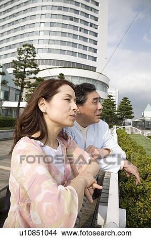 Mature couple looking at view View Large Photo Image Picture - Mature couple looking at view. Fotosearch