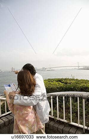 Stock Image - Mature couple looking at view. Fotosearch