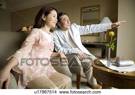 Mature couple sitting and talking View Large Photo Image Picture - Mature couple sitting and talking. Fotosearch
