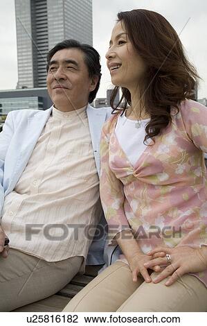 Mature couple sitting View Large Photo Image Stock Image - Mature couple sitting. Fotosearch