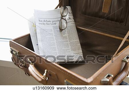 Newspaper in suitcase View Large Photo Image Stock Photo - Newspaper in suitcase. Fotosearch