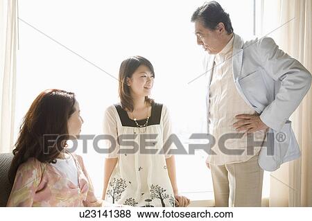 Parents and daughter talking View Large Photo Image Stock Photo - Parents and daughter talking. Fotosearch