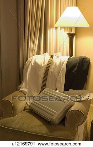Shirt and bag on sofa View Large Photo Image Stock Image - Shirt and bag on sofa. Fotosearch