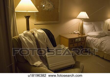 Stock Image - Shirt and bag on sofa. Fotosearch