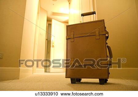 Suitcase in hotel corridor View Large Photo Image Stock Image - Suitcase in hotel corridor. Fotosearch