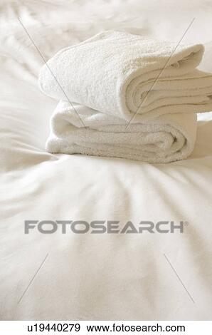 Stock Photo - Towels on bed. Fotosearch