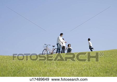 Stock Photo - Boy running to parents. Fotosearch