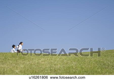 Stock Photograph - Children running in field. Fotosearch