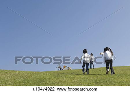 Stock Image - Children running to mother. Fotosearch