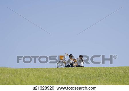 Children sitting in field View Large Photo Image Stock Image - Children sitting in field. Fotosearch