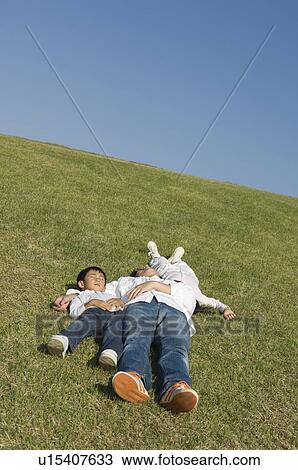 Father and children sleeping in field View Large Photo Image Stock Image - Father and children sleeping in field. Fotosearch