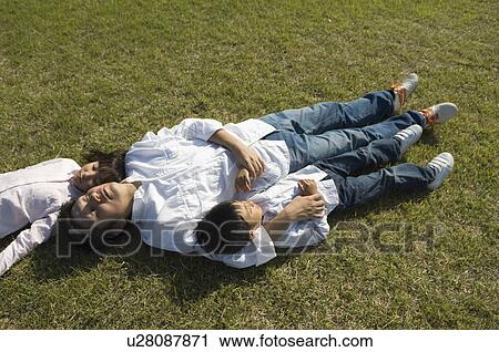 Father and children sleeping in field View Large Photo Image Stock Image - Father and children sleeping in field. Fotosearch