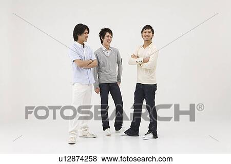 Stock Photo - Three young men talking. Fotosearch