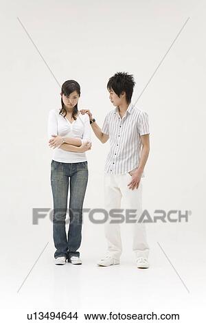 Young man comforting his girlfriend View Large Photo Image Picture - Young man comforting his girlfriend. Fotosearch