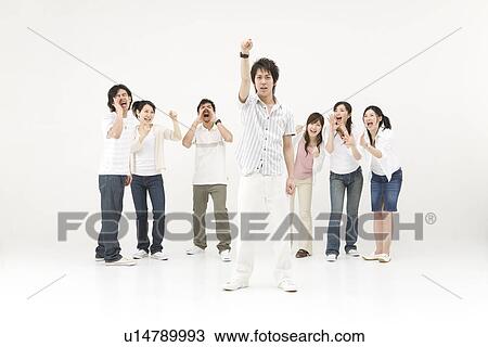 Stock Image - Young people cheering their friend. Fotosearch
