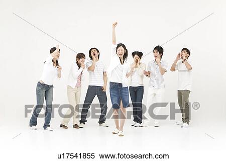 Stock Photography - Young people cheering their friend. Fotosearch