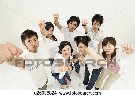 Picture - Young people raising hands. Fotosearch