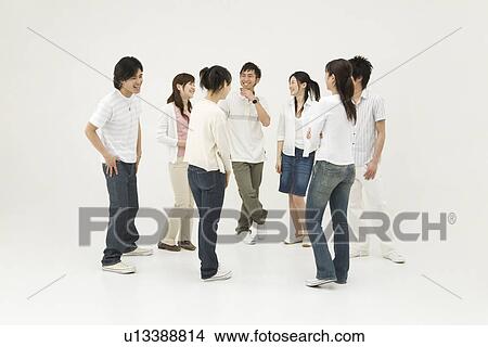 Picture - Young people standing in circle. Fotosearch