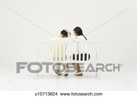Picture - Young woman comforting her friend. Fotosearch
