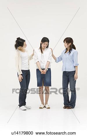 Young women comforting their friend View Large Photo Image Stock Image - Young women comforting their friend. Fotosearch