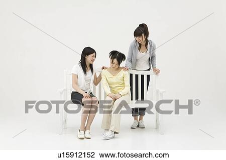 Young women comforting their friend View Large Photo Image Stock Image - Young women comforting their friend. Fotosearch