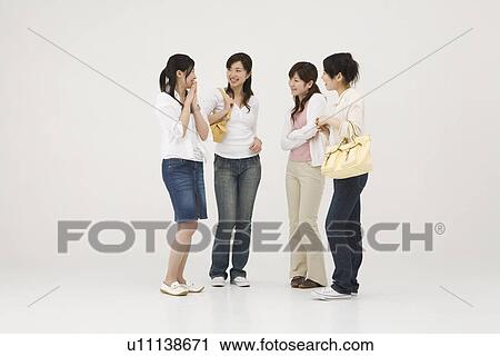 Young women talking View Large Photo Image Stock Image - Young women talking. Fotosearch