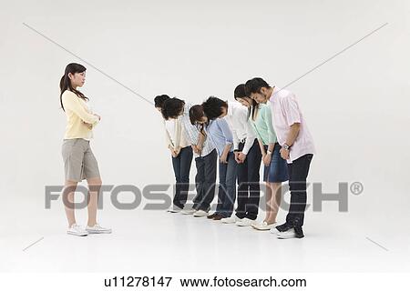 Stock Photo - Group of people bowing to a young woman. Fotosearch