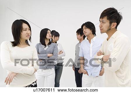 Group of people glaring at each other View Large Photo Image Stock Image - Group of people glaring at each other. Fotosearch