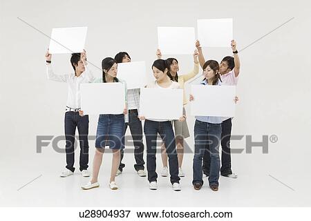 Group of people holding blank message board View Large Photo Image Stock Photo - Group of people holding blank message board. Fotosearch