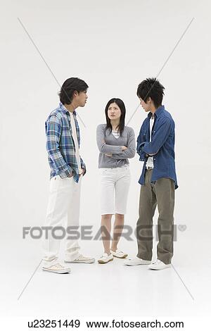 Three young people glaring at each other View Large Photo Image Stock Photo - Three young people glaring at each other. Fotosearch