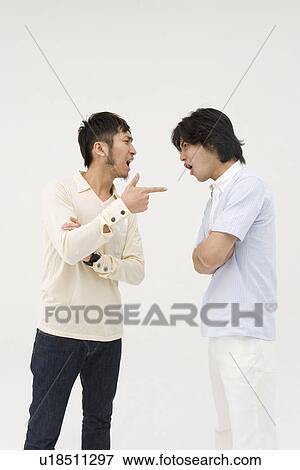 Stock Photo - Two young men arguing. Fotosearch