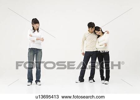 Young woman and couple View Large Photo Image Stock Image - Young woman and couple. Fotosearch